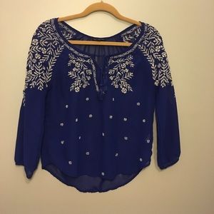 Royal blue blouse with white detailing